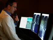 A radiologist interprets medical images on a modern Picture Archiving and Communication System (PACS). San Diego, CA, 2010.