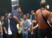 Former Lifehouse bassist Sergio Andrade (left) and Lifehouse lead singer Jason Wade (right) perform in front of a crowd in a restaurant in the music video.