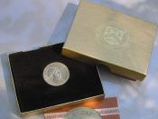 A half ounce medallion depicting Willa Cather, in original box of issue