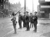 English: five policemen and one soldier with a rifle standing on a street corner during a race riot in the Douglas community area of Chicago, Illinois.