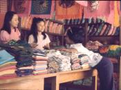 English: negotiating with fabric store owners in Chiang Mai, thailand. November 1973