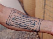 English: First Sergeant Aki Paylor, Echo Company, 1st Attack Reconnaissance Battalion, 10th Combat Aviation Brigade, had the Warrior Ethos tattooed on his arm while on leave from his current deployment to Iraq. 