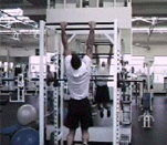 User:Extremepullup performing a muscle-up - a variant on the standard pull-up.