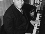 English: Fats Waller, three-quarter length portrait, seated at piano, facing front.