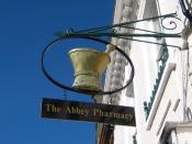 English: Pharmacy sign - Cheap Street This is the trade sign for The Abbey Pharmacy. The pestle and mortar were the essential items of equipment for the traditional pharmacist. Virtually anything could be ground up and put into all types of medication be 