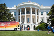 First Lady Michelle Obama participates in the filming of an episode of Extreme Makeover: Home Edition on the South Lawn of the White House, July 27, 2011. (Official White House Photo by Samantha Appleton)