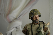 An Iraqi army soldier takes a break during an operation in New Baqubah, Iraq. The purpose of the operation is to eliminate New Baqubah as an operating base for improvised explosive device building cells and key leaders of anti-Iraqi forces in Iraq.
