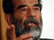 English: Former President of Iraq, Saddam Hussein, makes a point during his initial interview by a special tribunal, where he is informed of his alleged crimes and his legal rights. Deutsch: der ehemalige Präsident des Irak, Saddam Hussein, bei seiner Ste