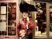 English: Lawrence Ferlinghetti Poet and young Sylvia Whitman in front of Shakespeare and Company Book Shop in Paris France 1981 photo by Jon Hammond