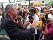 English: Photo of Tom Hayden addressing an anti-war demonstration in Boston during the 2004 Democratic National Convention by Brian Corr, July 29, 2004. Released under GNU Free Documentation License
