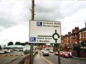 English: I took this picture of a Welsh language (y Gymraeg) road sign near Wrexham Central station my self in the year 2009. I here by release it in to the public domain.