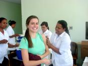 English: Woman receiving rubella vaccination, School of Public Health of the State of Minas Gerais (ESP-MG), Brazil