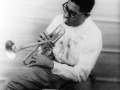 Portrait of Dizzy Gillespie (John Birks), 1955 Dec. 2. Full-length portrait, seated, facing left, playing horn.