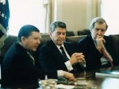 English: President Ronald Reagan receives the Tower Commission Report regarding the Iran-Contra affair in the Cabinet Room with John Tower and Edmund Muskie.
