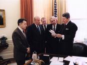 President Ronald Reagan with Caspar Weinberger, George Shultz, Ed Meese, and Don Regan discussing the President's remarks on the Iran-Contra affair, Oval Office