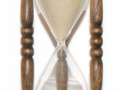 Alternative version of image:Wooden hourglass 2.jpg. Wooden hourglass. Total height:25 cm. Wooden disk diameter: 11.5 cm. Running time of the hourglass: 1 hour. Hourglass in other languages: 'timglas' (Swedish), 'sanduhr' (German), 'sablier' (French), 're