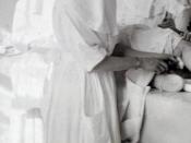 Empress Alexandra of Russia and her daughters nursing military patients (c.early 20th century).