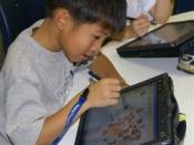 Avery Coonley School student with tablet computer.