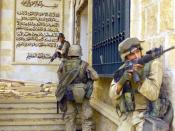 English: US Marines Corps (USMC) Marines from the 1st Battalion, 7th Marines (1/7), Charlie Company, Twentynine Palms, California (CA), cover each other with 5.56 mm M16A2 assault rifles as they prepare to enter one of Saddam Husseins palaces in as they t