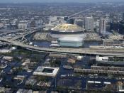 Excerpt from US Navy photo http://www.navy.mil/view_single.asp?id=27553, an aerial view from a United States Navy helicopter showing floodwaters around the entire downtown New Orleans area. The Louisiana Superdome is in the center.