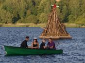 Students from Danish Gymnasium celebrates their exams in a boat on Sankt Hans Eve (a midsummer celebration in Denmark) next to a Danish bonfire with a traditional 
