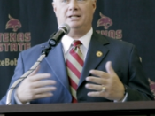 English: Dennis Franchione speaking at a press conference on January 7, 2011