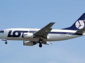 English: LOT Polish Airlines Boeing 737-500 (SP-LKB) lands at London Heathrow Airport.