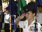 English: Battalion Commander Cadet Ensign Melanie Leonard, Radford High School Junior ROTC (Reserve Officers Training Corps), salutes during the parading of the colors ceremony held at the Parchee Memorial Submarine Base at this year's Memorial Day Ceremo