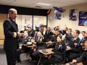 US Navy 090304-N-3271W-082 Rear Adm. Leendert R. Hering Sr., commander of Navy Region Southwest, visits with students from the Carl Hayden High School Navy Junior Reserve Officers Training Corps (JROTC) class