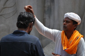 English: Hindu priest giving blessing in Belur, Karnataka.