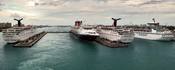 A panoramic view of Prince George Wharf, the facility serving passenger cruise ships in Nassau Harbour, off the island of New Providence in the Bahamas. Seen docked along the wharf, left to right, are the MS Carnival Fascination, MS Disney Wonder, MS Carn