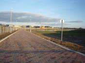 English: Road onto Heslington East Construction of the main service road onto the new university campus was well underway until the contractor went bankrupt. Construction work on the campus is on hold as new contractors are appointed. In the distance the 