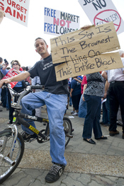 A protest sign during a demonstration, joking about the fact that the demonstration is, according to the holder, only composed of white people.