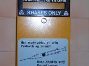 A bin allowing for safe disposal of needles in a public toilet in Caernarfon, Wales.