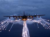 A United States Air Force Lockheed MC-130 using flares.