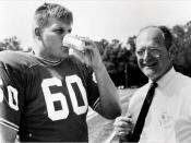 University of Florida football player Chip Hinton testing out Gatorade in 1965, pictured next to one of its inventors, James Robert Cade
