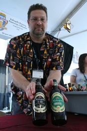 English: Fred Gilbert, an Ararat Import Export Co. sales representative, shows off bottles of Kalnapilis beer from Lithuania at the 13th Annual World Beer Festival held at the Durham Bulls Athletic Park in Durham, North Carolina.