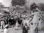 Hindus and Muslims, displaying flags of the Indian National Congress and the Muslim League, collecting clothes to be burnt as a part of the Non-cooperation movement, 1922.