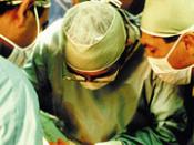 Surgeons performing an organ transplantation