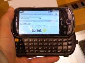 English: Samsung Intercept open in my hand and showing Wikipedia page about Sprint Nextel.
