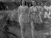 English: Swimsuit fashion parade at Government House, Brisbane, December 1940 Two models in fashionable swimwear in the gardens at Government House at the annual Red Cross Fete.