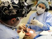 English: Photo of Mini Facelift Cosmetic Surgery Procedure being Performed by Facial Plastic Surgeon.