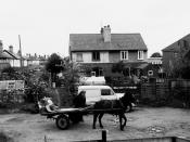 English: Rag and bone man, Forge Road, Great Sankey Forge Road is an unmade cul-de-sac off Station Road in Great Sankey. The old forge, the roof of which can be seen on the extreme right, was used as a workshop for many years until converted to a bungalow