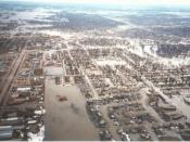 Red River of the North Main Stem, Grand Forks, North Dakota, looking toward Downtown area. Taken from a helicopter during the 1997 Red River Flood, after a levee overtopped and Grand Forks was evacuated.