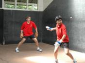 Two students playing Fives at Alleyn's School.