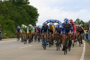 The peloton during the 2005 Tour de France. Clustering of the teams is apparent.