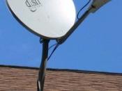 A satellite television dish, an example of an offset fed dish.