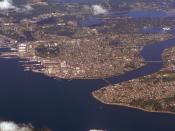 Sinclair Inlet and Puget Sound Naval Shipyard (left), Dyes Inlet (middle distance) and Manette and Warren Avenue Bridges (left to right) across Port Washington Narrows