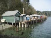 English: Some of the many beach cottages built on piers over Puget Sound in Fragaria Washington in Kitsap County along Colvos Passage.