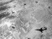 English: The shadow of a U.S. Air Force McDonnell RF-101C Voodoo is caught on a photo of a North Vietnamese flak site, circa 1965/67.